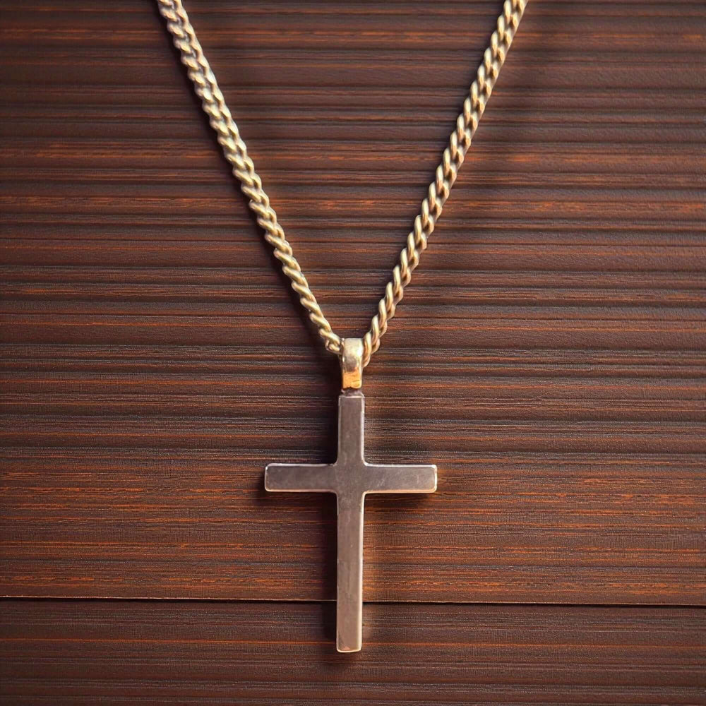 Handcrafted solid bronze cross necklace on an antique bronze chain. Custom lengths available. Made in USA with a lifetime warranty.