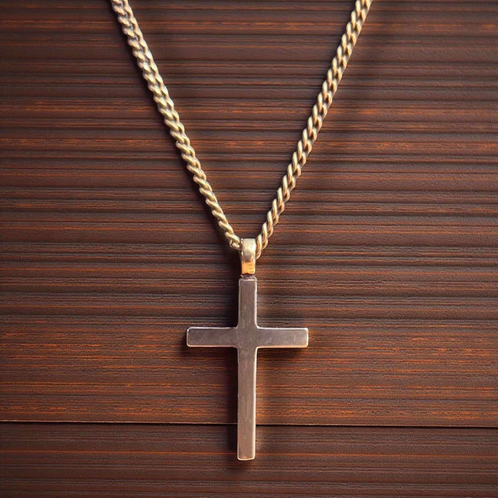 Handcrafted solid bronze cross necklace on an antique bronze chain. Custom lengths available. Made in USA with a lifetime warranty.