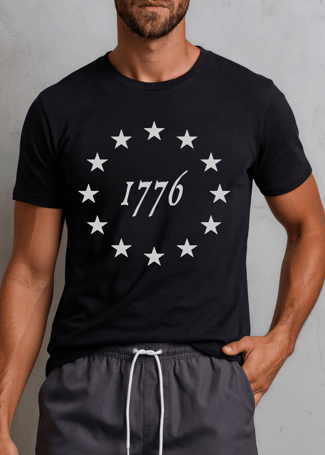 Men's 1776 Betsy Ross 13-star circle graphic tee in Navy or Black. Made in USA, 100% ring-spun cotton, relaxed unisex fit. Perfect patriotic tee.