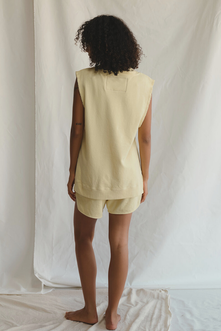 Shop the Villa Vest by People of Leisure — raw edge, ribbed V-neck in hemp &amp; organic cotton. Limoncello &amp; Sand. Sizes XS–XL.
