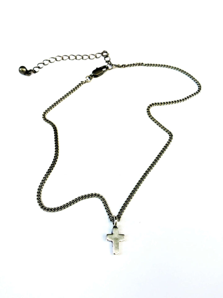 Handcrafted solid sterling silver cross choker necklace on stainless steel. Choker to 22 inch. Made in USA with a lifetime warranty