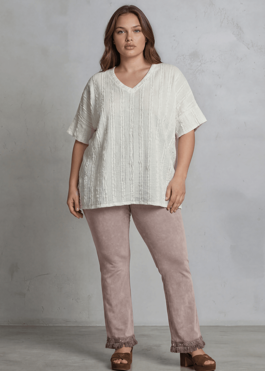 Shop the Plus Size Laurel Textured Top — relaxed oversized v-neck with striped lace effect, contrast sleeve bands &amp; side slit. Sizes 1X–3X. Made in USA.