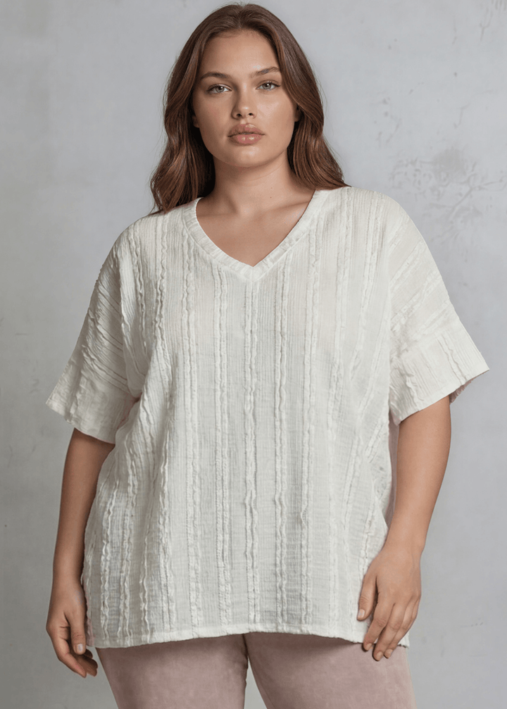 Shop the Plus Size Laurel Textured Top — relaxed oversized v-neck with striped lace effect, contrast sleeve bands &amp; side slit. Sizes 1X–3X. Made in USA.