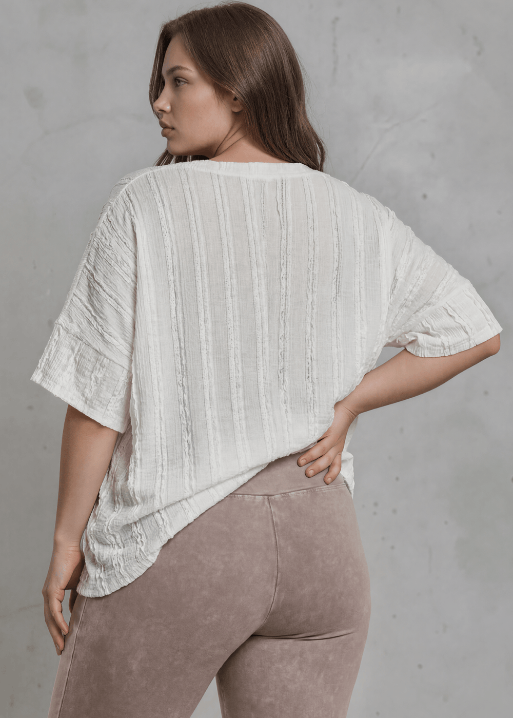 Shop the Plus Size Laurel Textured Top — relaxed oversized v-neck with striped lace effect, contrast sleeve bands & side slit. Sizes 1X–3X. Made in USA.