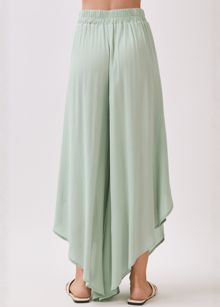 Breezy sage green flowy pants with elastic waist &amp; overlap split leg detail. Lightweight 100% rayon. Made in USA. Perfect for vacation &amp; resort wear.