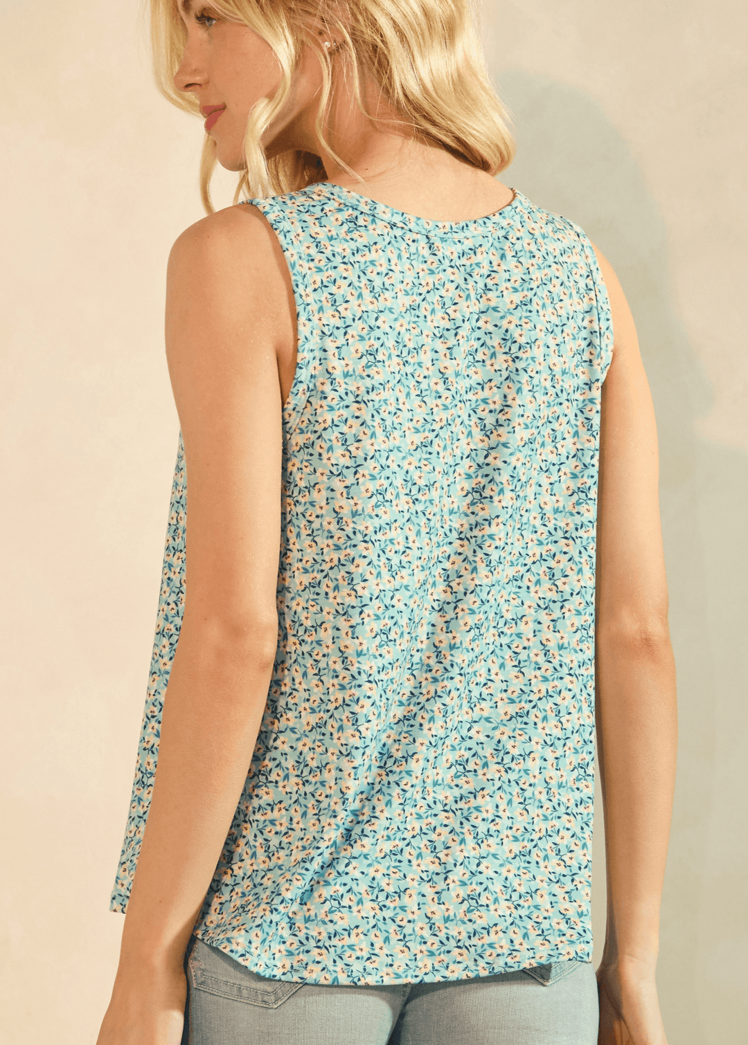 Fresh and Floral Sleeveless Top. Aqua ditsy floral, henley button neckline, relaxed A-line fit, lightweight. Perfect for summer. Made in USA.