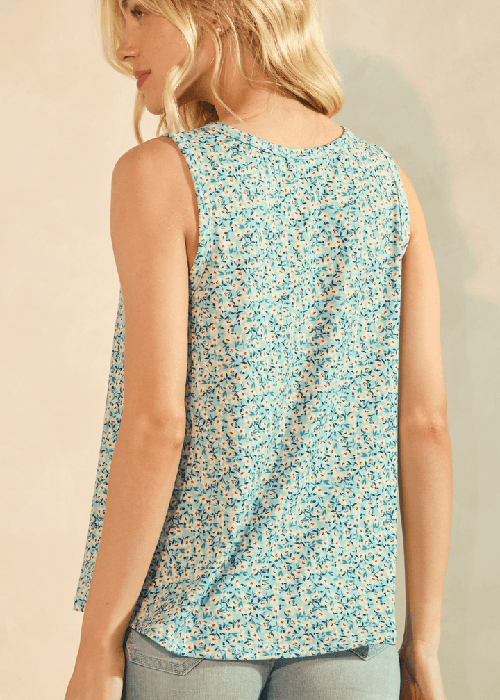 Fresh and Floral Sleeveless Top. Aqua ditsy floral, henley button neckline, relaxed A-line fit, lightweight. Perfect for summer. Made in USA.
