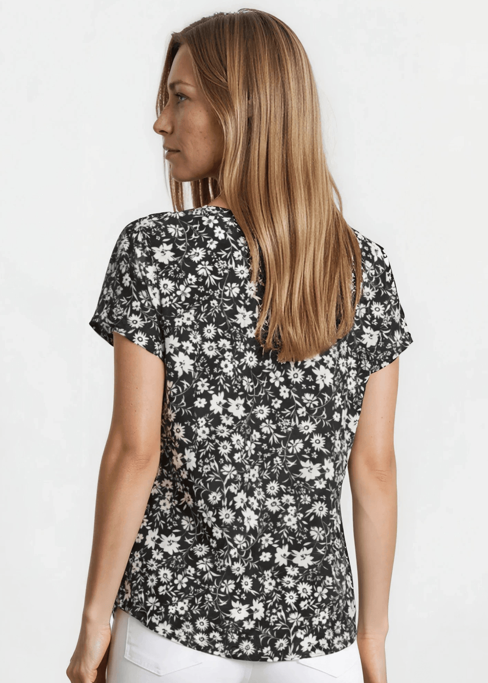 Faith's Floral Print Tee in Black. Soft stretch knit, allover ditsy floral, crew neck, regular fit. Effortlessly stylish. Made in USA. Sizes S–XL.