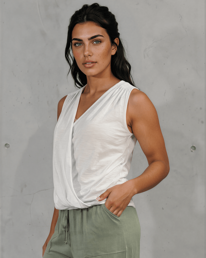 Shop the Courtney Cotton Surplice V Neck Top in White. Relaxed blousy fit, feminine V-neckline, soft 95% cotton. Proudly made in the USA. Sizes S–L.  Renee C Style 3463TP