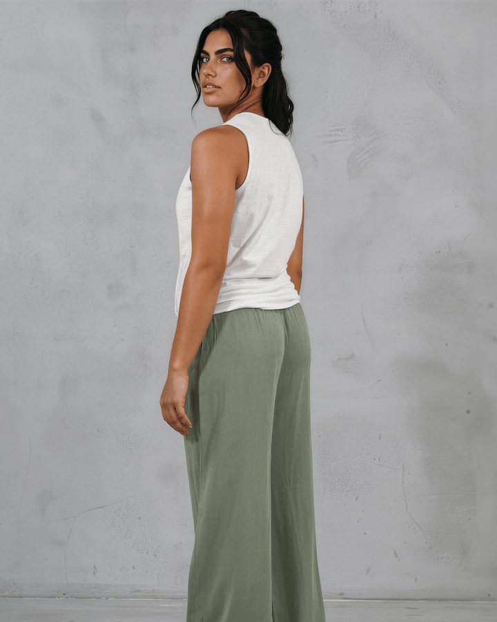Shop the Courtney Cotton Surplice V Neck Top in White. Relaxed blousy fit, feminine V-neckline, soft 95% cotton. Proudly made in the USA. Sizes S–L.  Renee C Style 3463TP