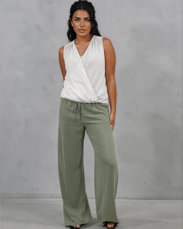 Shop the Courtney Cotton Surplice V Neck Top in White. Relaxed blousy fit, feminine V-neckline, soft 95% cotton. Proudly made in the USA. Sizes S–L.  Renee C Style 3463TP