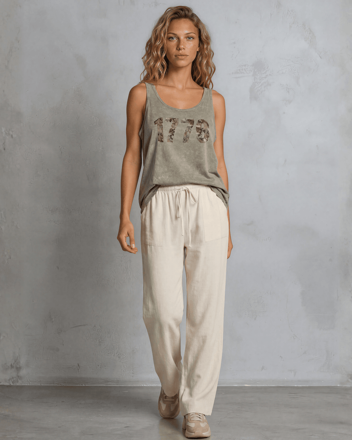 Annie wide leg pants in natural — adjustable drawstring waist, side pockets, rayon-linen blend. Relaxed fit, Made in USA. Perfect for resort &amp; vacation wear.