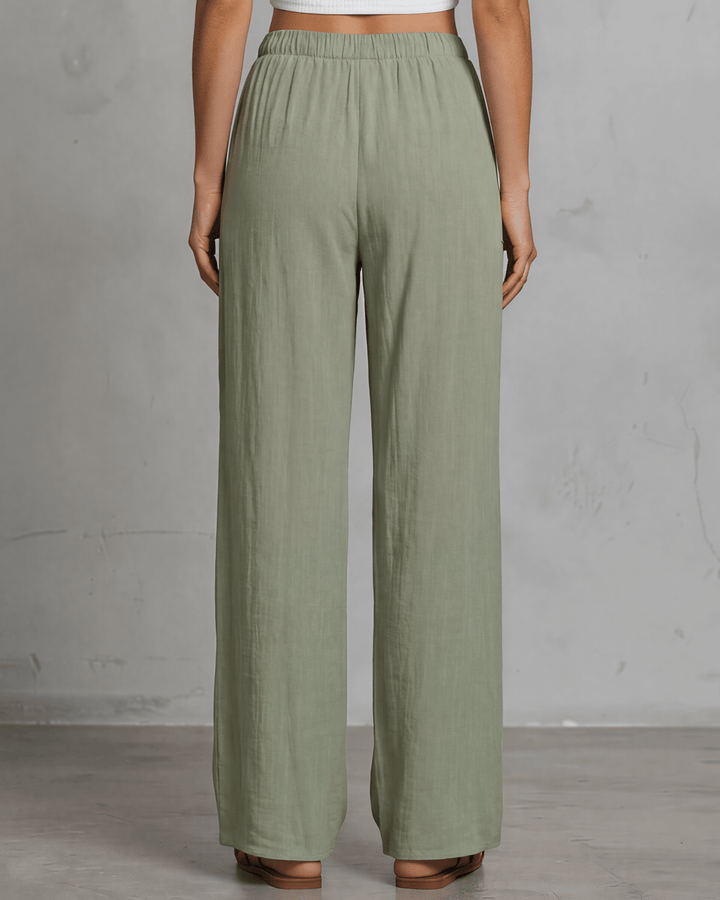Annie wide leg pants in light olive — adjustable drawstring waist, side pockets, rayon-linen blend. Relaxed fit, Made in USA. Perfect for resort &amp; vacation wear.