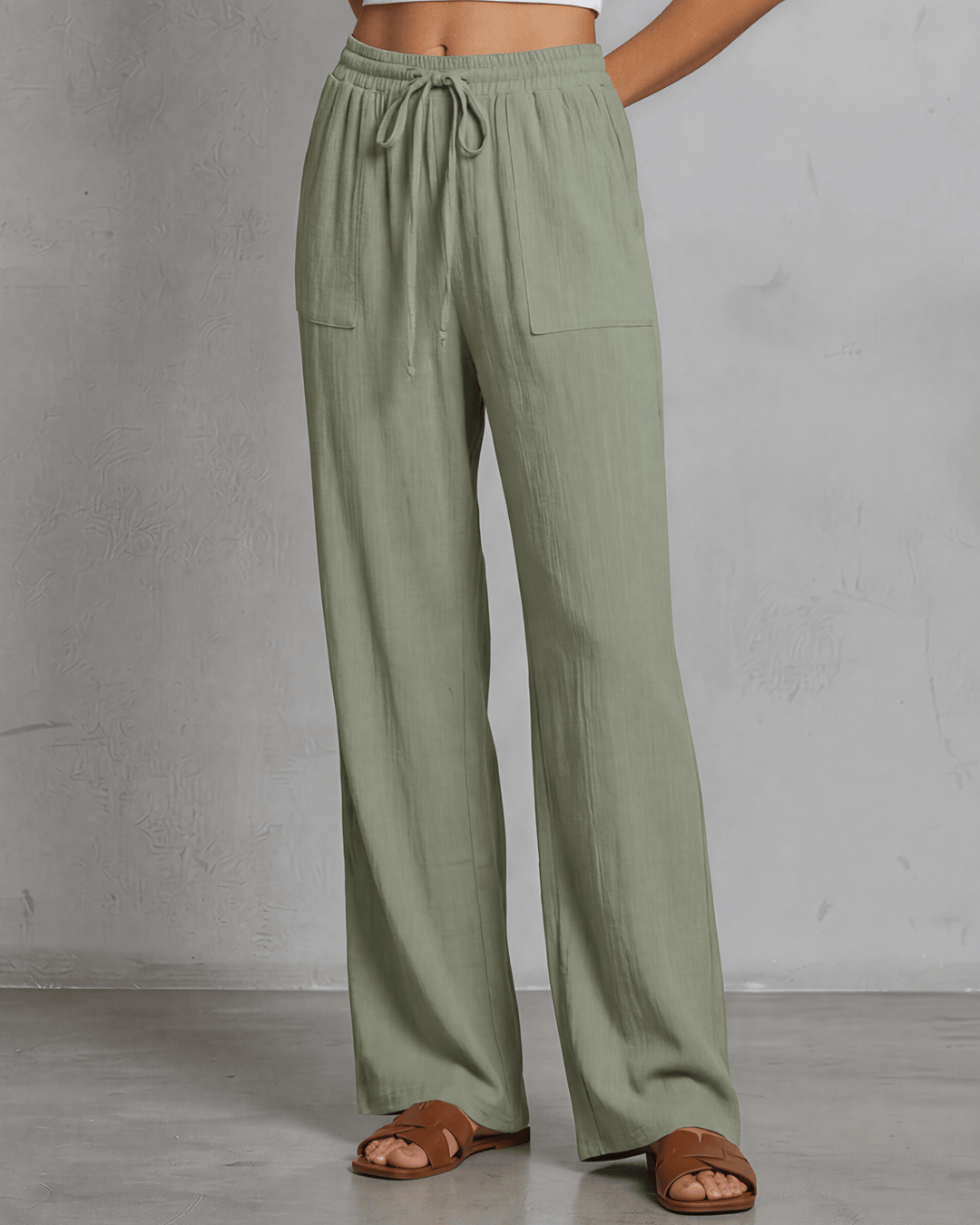 Annie wide leg pants in light olive — adjustable drawstring waist, side pockets, rayon-linen blend. Relaxed fit, Made in USA. Perfect for resort &amp; vacation wear.