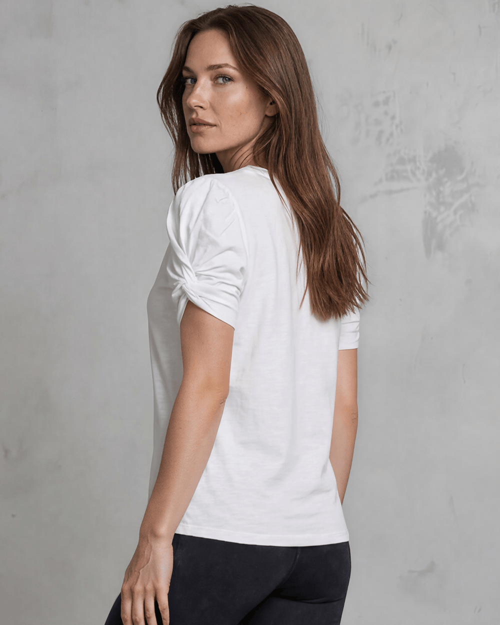Milly Cotton Puff Sleeve Top with ruched knot detail. Soft cotton-spandex, crew neck, relaxed fit. Elevated everyday style. Made in USA.