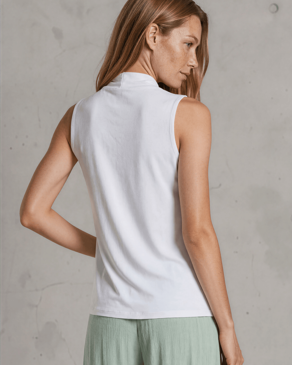 Nikki Cowl Neck Jersey Top in White. Soft rayon-spandex, draped cowl neck, semi-fitted, sleeveless. Polished & versatile. Made in USA. Sizes S–L.