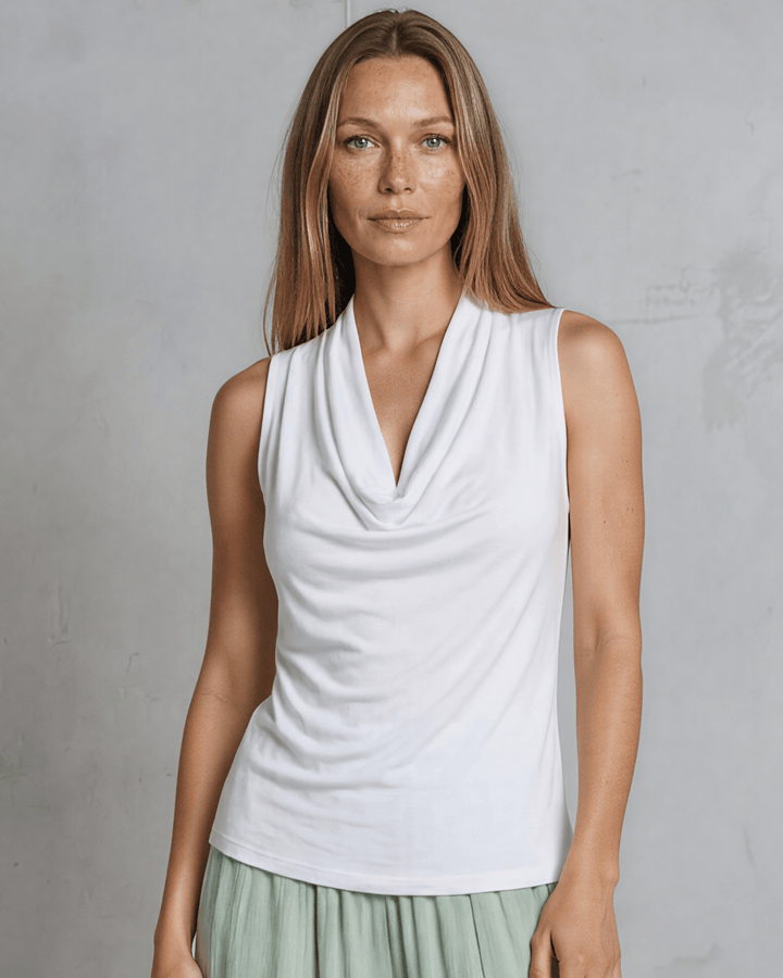 Nikki Cowl Neck Jersey Top in White. Soft rayon-spandex, draped cowl neck, semi-fitted, sleeveless. Polished &amp; versatile. Made in USA. Sizes S–L.