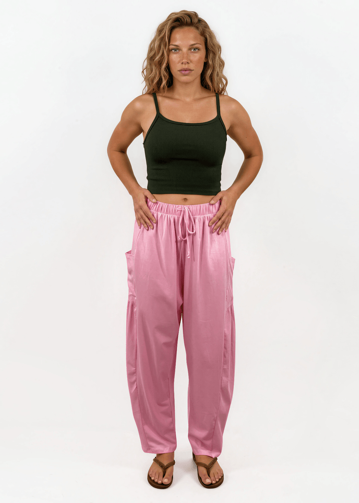 Shop the Bailey Baggy Drawstring Pants in Pink. Relaxed fit, deep pockets, soft cotton-spandex blend. Perfect for lounging and weekends. Made in USA.