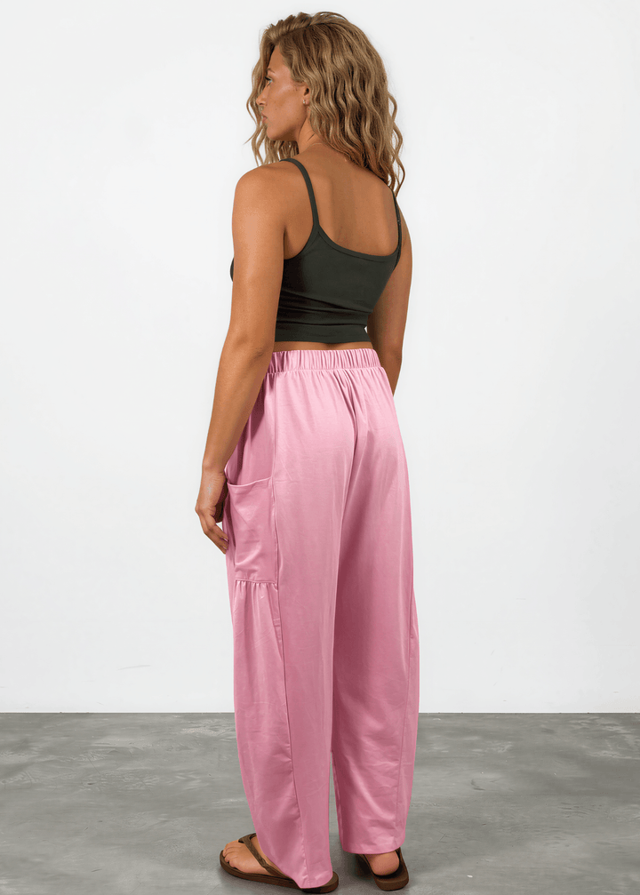 Shop the Bailey Baggy Drawstring Pants in Pink. Relaxed fit, deep pockets, soft cotton-spandex blend. Perfect for lounging and weekends. Made in USA.