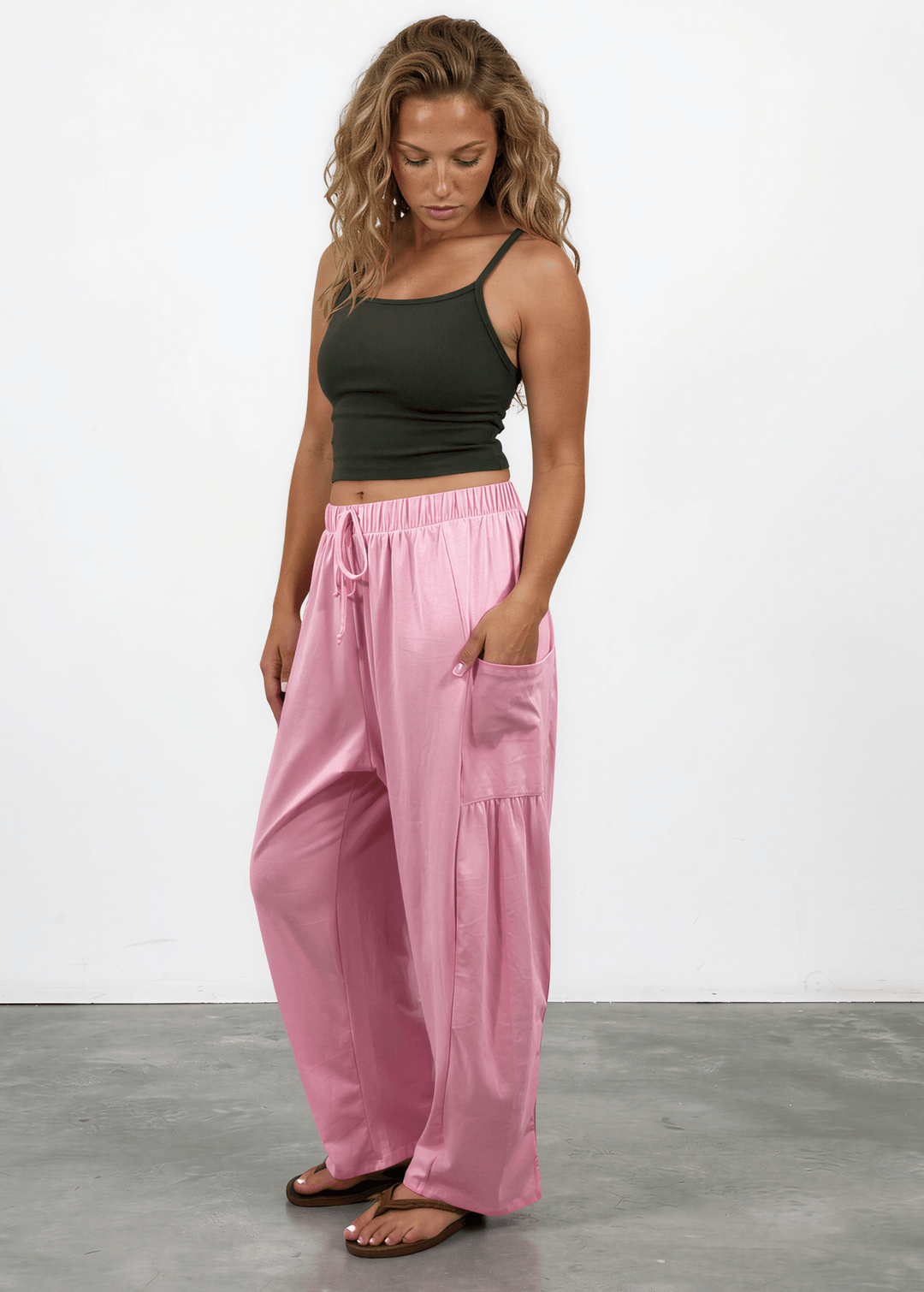 Shop the Bailey Baggy Drawstring Pants in Pink. Relaxed fit, deep pockets, soft cotton-spandex blend. Perfect for lounging and weekends. Made in USA.