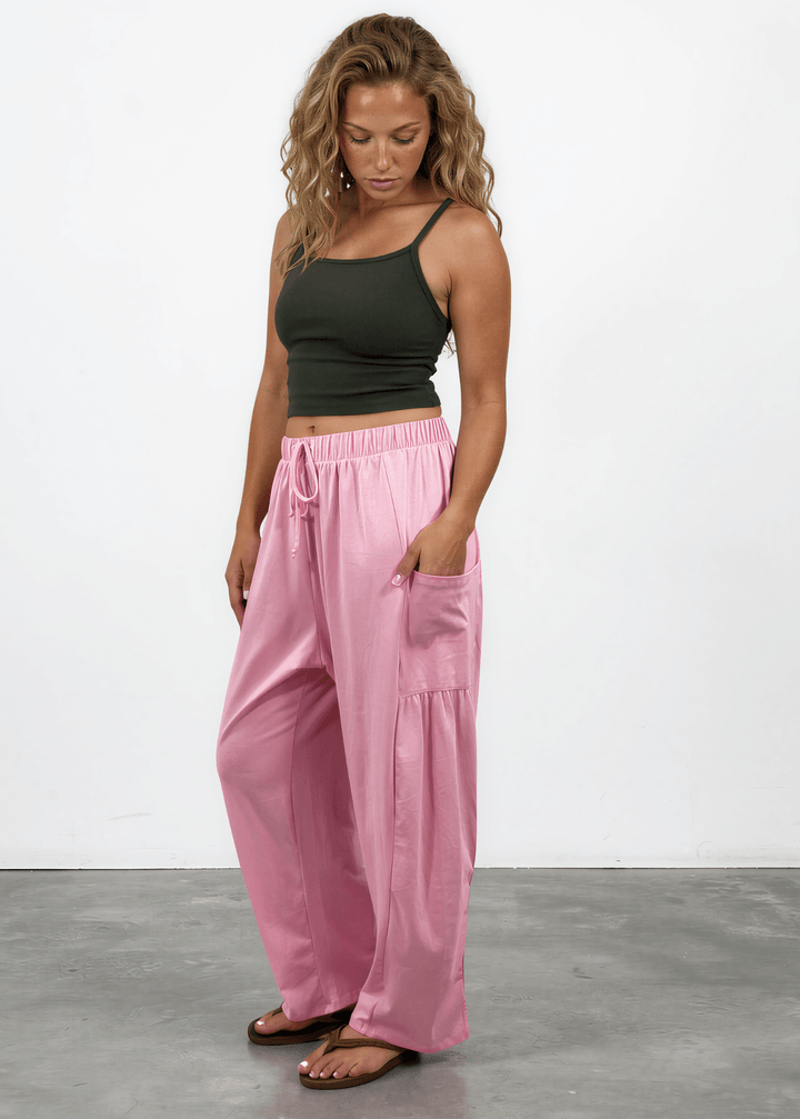 Shop the Bailey Baggy Drawstring Pants in Pink. Relaxed fit, deep pockets, soft cotton-spandex blend. Perfect for lounging and weekends. Made in USA.