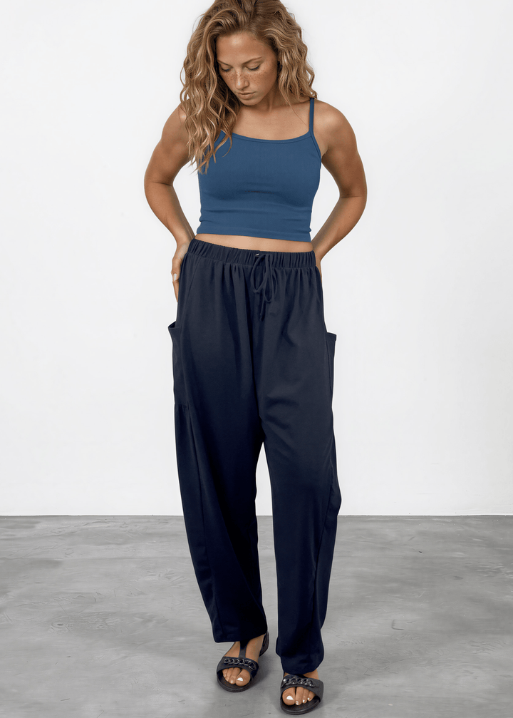Shop the Bailey Baggy Drawstring Pants in Black. Relaxed fit, deep pockets, soft cotton-spandex blend. Perfect for lounging and weekends. Made in USA.