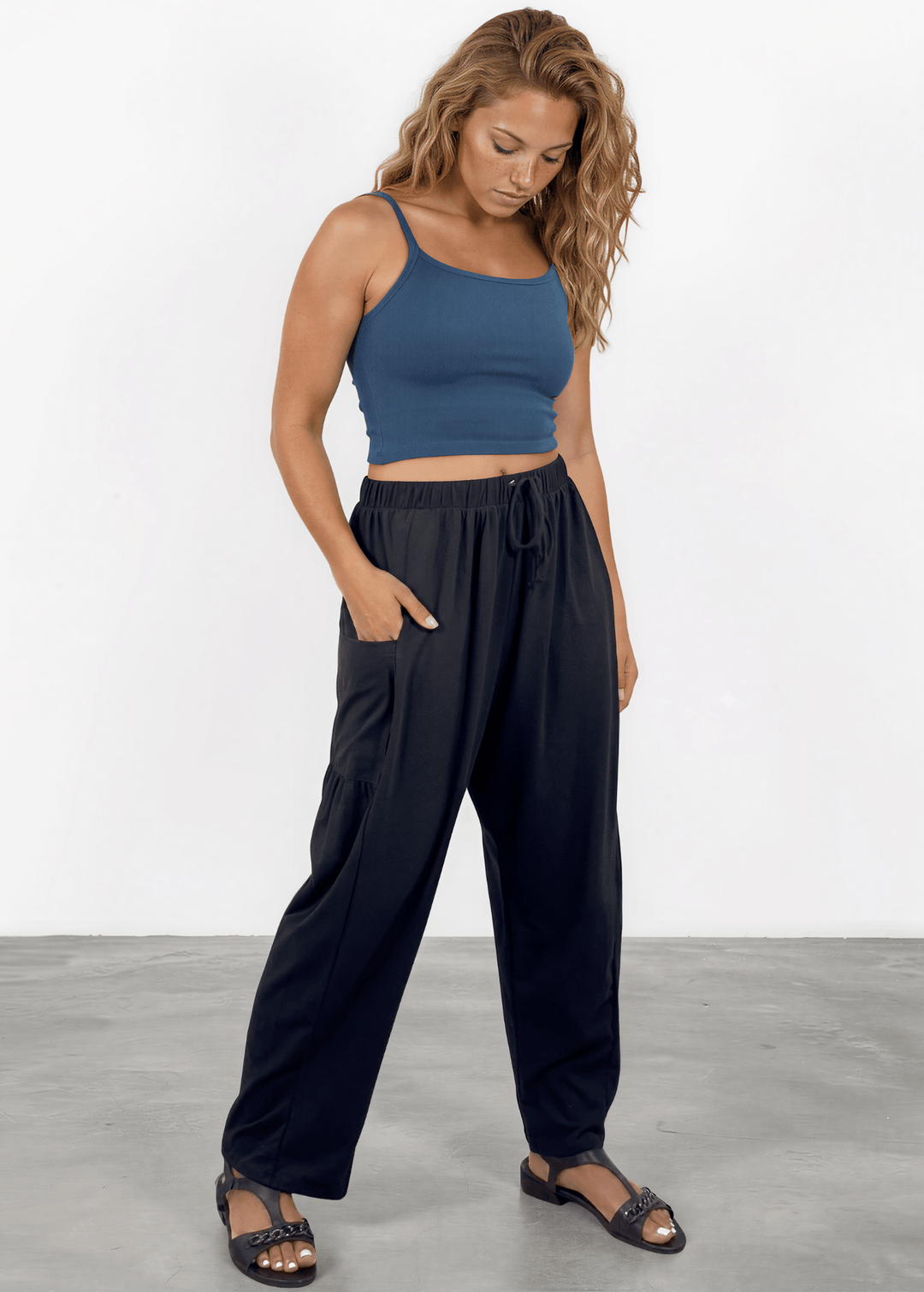 Shop the Bailey Baggy Drawstring Pants in Black. Relaxed fit, deep pockets, soft cotton-spandex blend. Perfect for lounging and weekends. Made in USA.