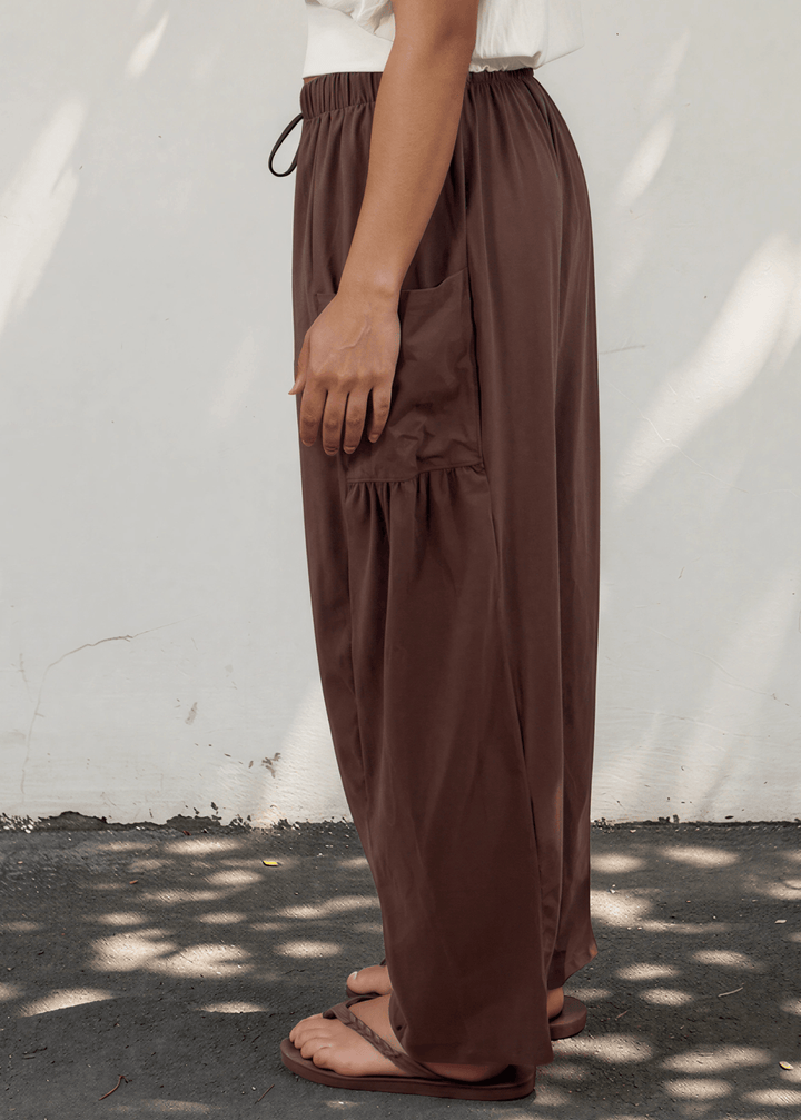 Bailey Baggy Drawstring Pants in Brown. Relaxed fit, deep pockets, soft cotton-spandex blend. Perfect for lounging and weekends. Made in USA.