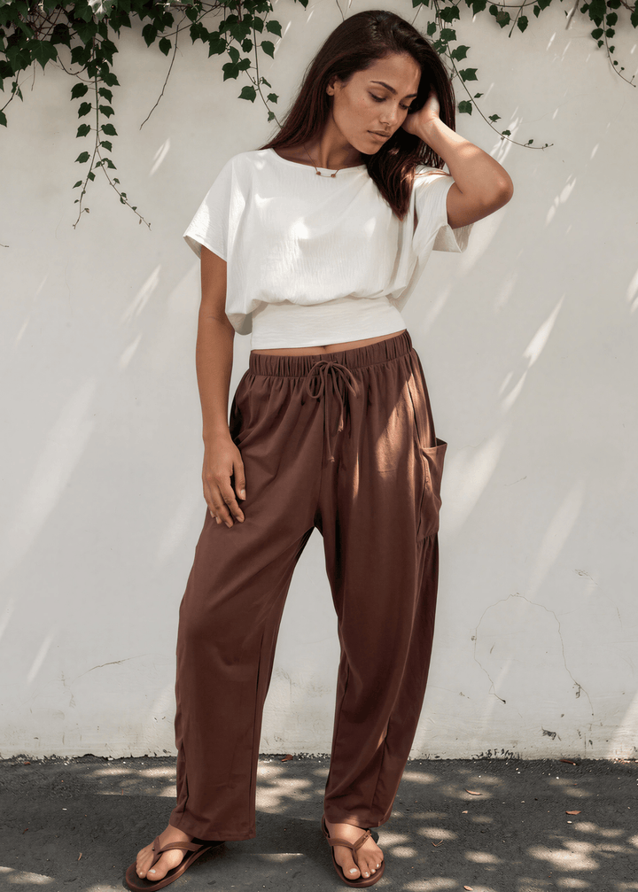 Bailey Baggy Drawstring Pants in Brown. Relaxed fit, deep pockets, soft cotton-spandex blend. Perfect for lounging and weekends. Made in USA.