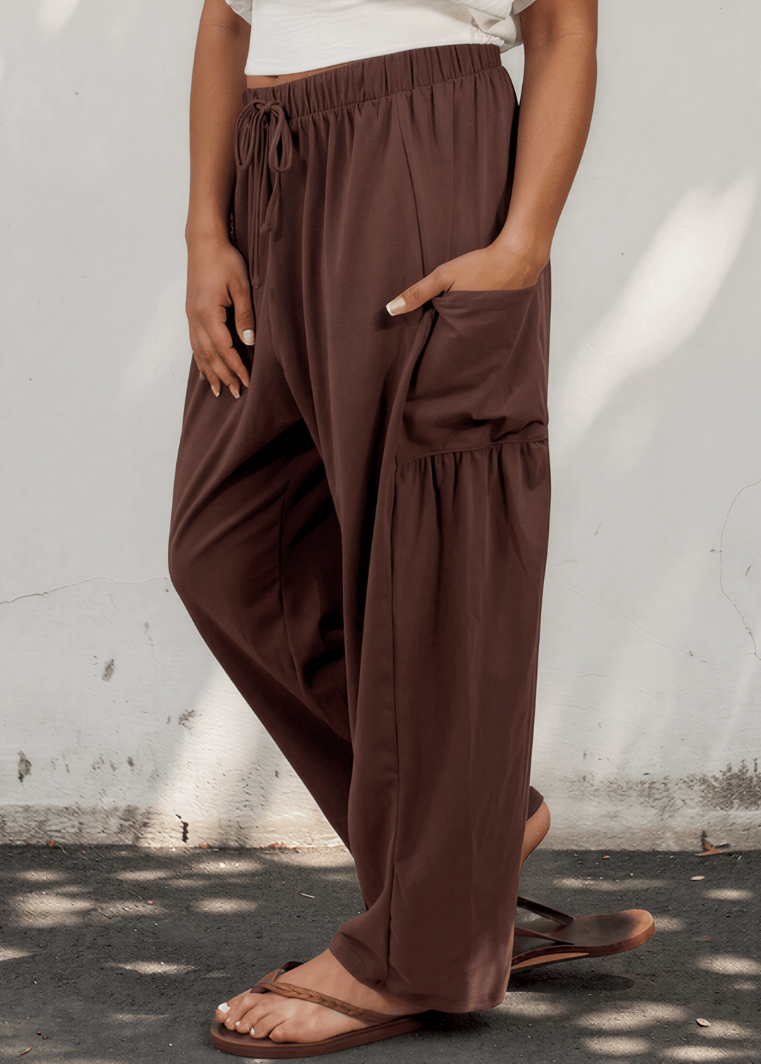 Bailey Baggy Drawstring Pants in Brown. Relaxed fit, deep pockets, soft cotton-spandex blend. Perfect for lounging and weekends. Made in USA.