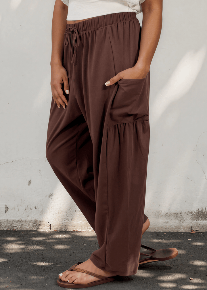 Bailey Baggy Drawstring Pants in Brown. Relaxed fit, deep pockets, soft cotton-spandex blend. Perfect for lounging and weekends. Made in USA.