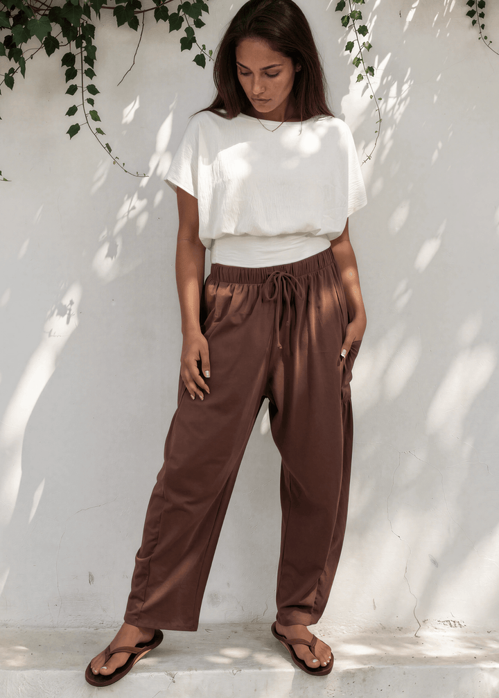 Bailey Baggy Drawstring Pants in Brown. Relaxed fit, deep pockets, soft cotton-spandex blend. Perfect for lounging and weekends. Made in USA.