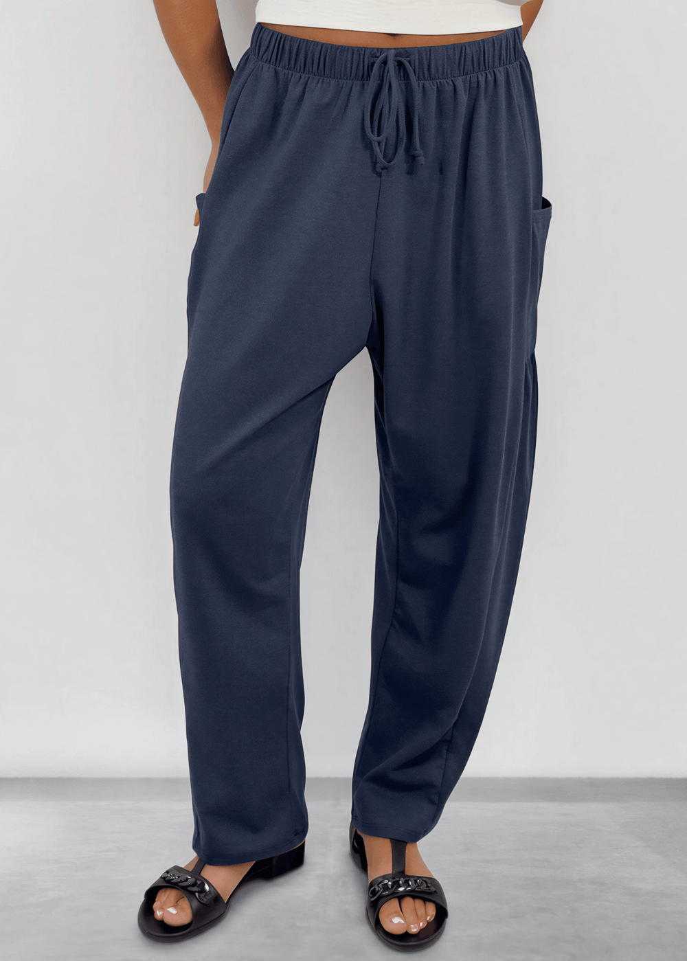 Shop the Bailey Baggy Drawstring Pants in Navy. Relaxed fit, deep pockets, soft cotton-spandex blend. Perfect for lounging and weekends. Made in USA.