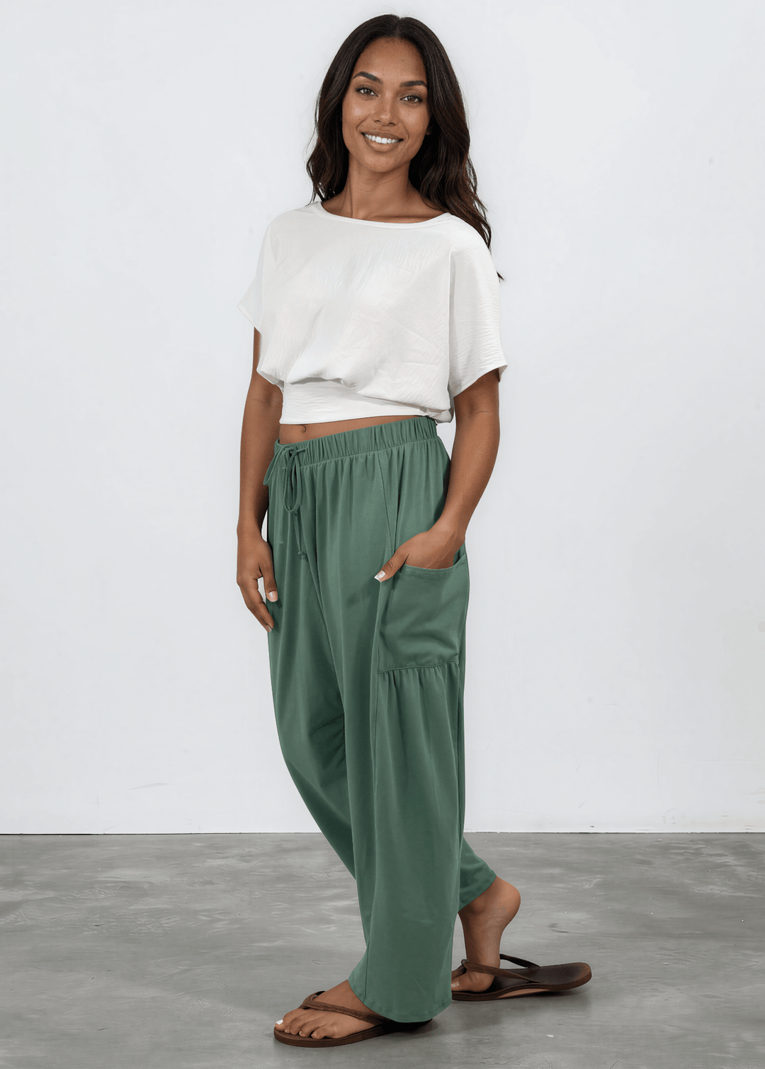Shop the Bailey Baggy Drawstring Pants in Sage. Relaxed fit, deep pockets, soft cotton-spandex blend. Perfect for lounging and weekends. Made in USA.