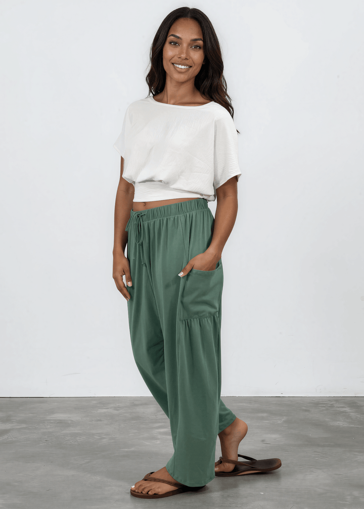Shop the Bailey Baggy Drawstring Pants in Sage. Relaxed fit, deep pockets, soft cotton-spandex blend. Perfect for lounging and weekends. Made in USA.