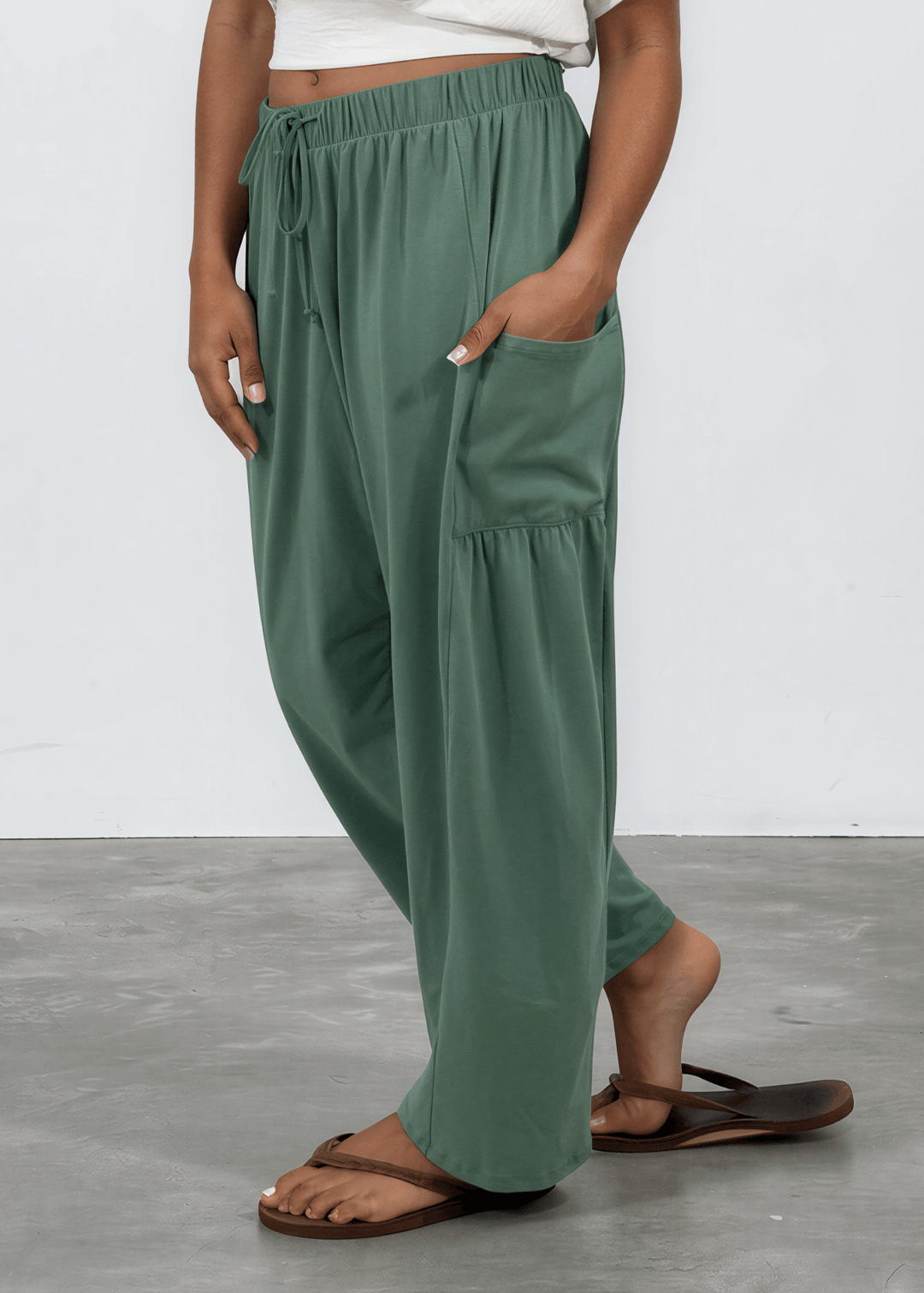 Shop the Bailey Baggy Drawstring Pants in Sage. Relaxed fit, deep pockets, soft cotton-spandex blend. Perfect for lounging and weekends. Made in USA.