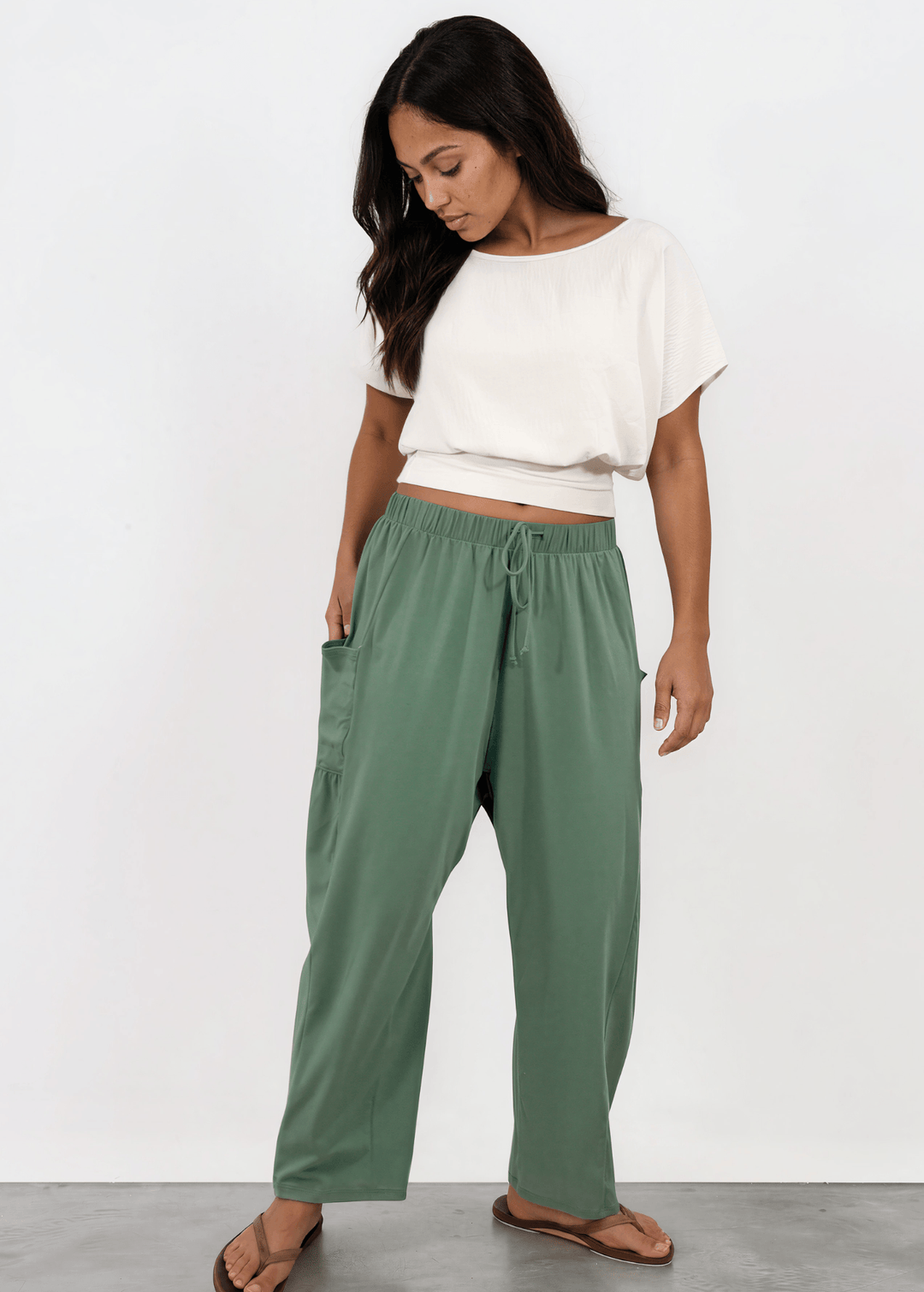 Shop the Bailey Baggy Drawstring Pants in Sage. Relaxed fit, deep pockets, soft cotton-spandex blend. Perfect for lounging and weekends. Made in USA.