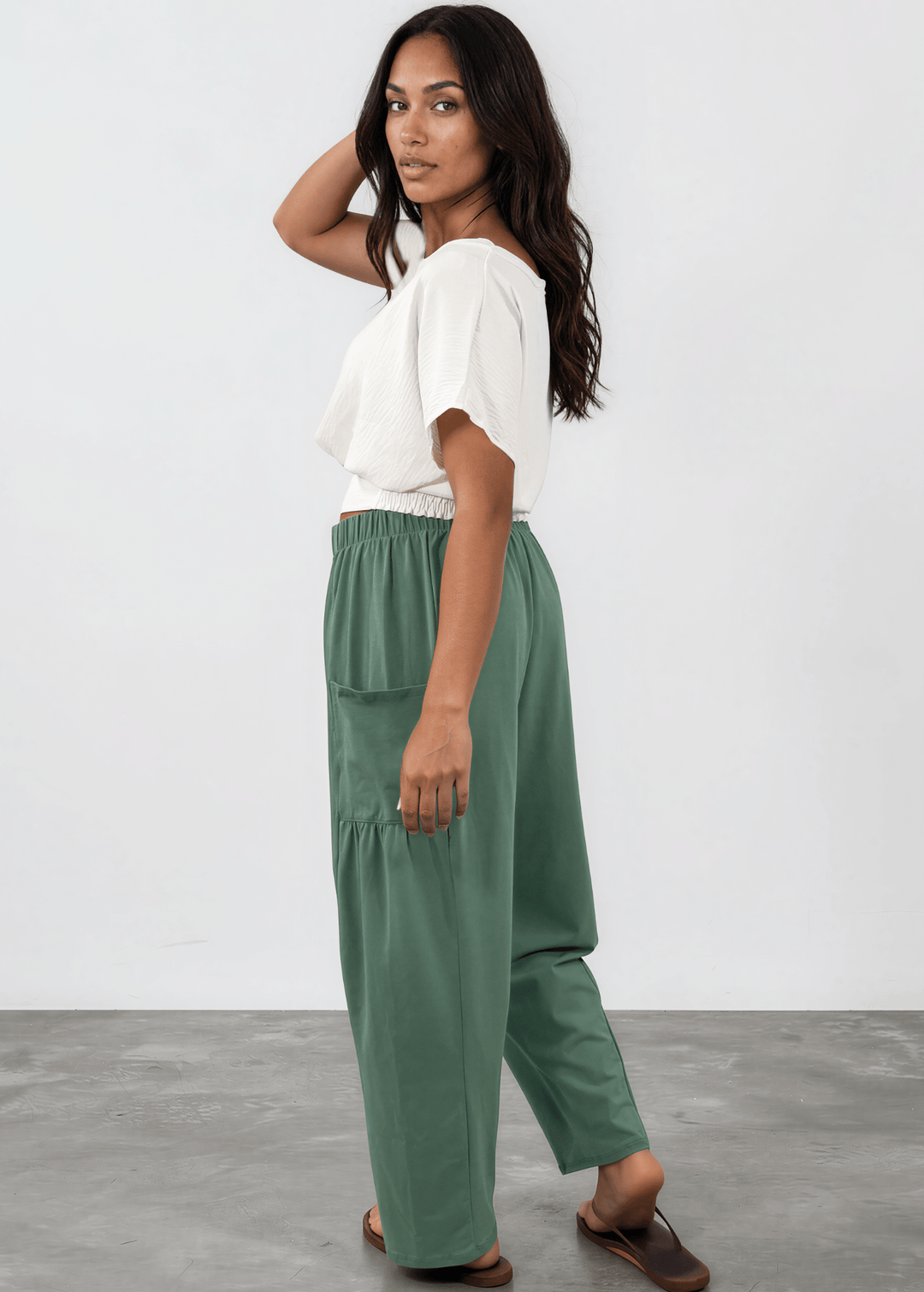 Shop the Bailey Baggy Drawstring Pants in Sage. Relaxed fit, deep pockets, soft cotton-spandex blend. Perfect for lounging and weekends. Made in USA.