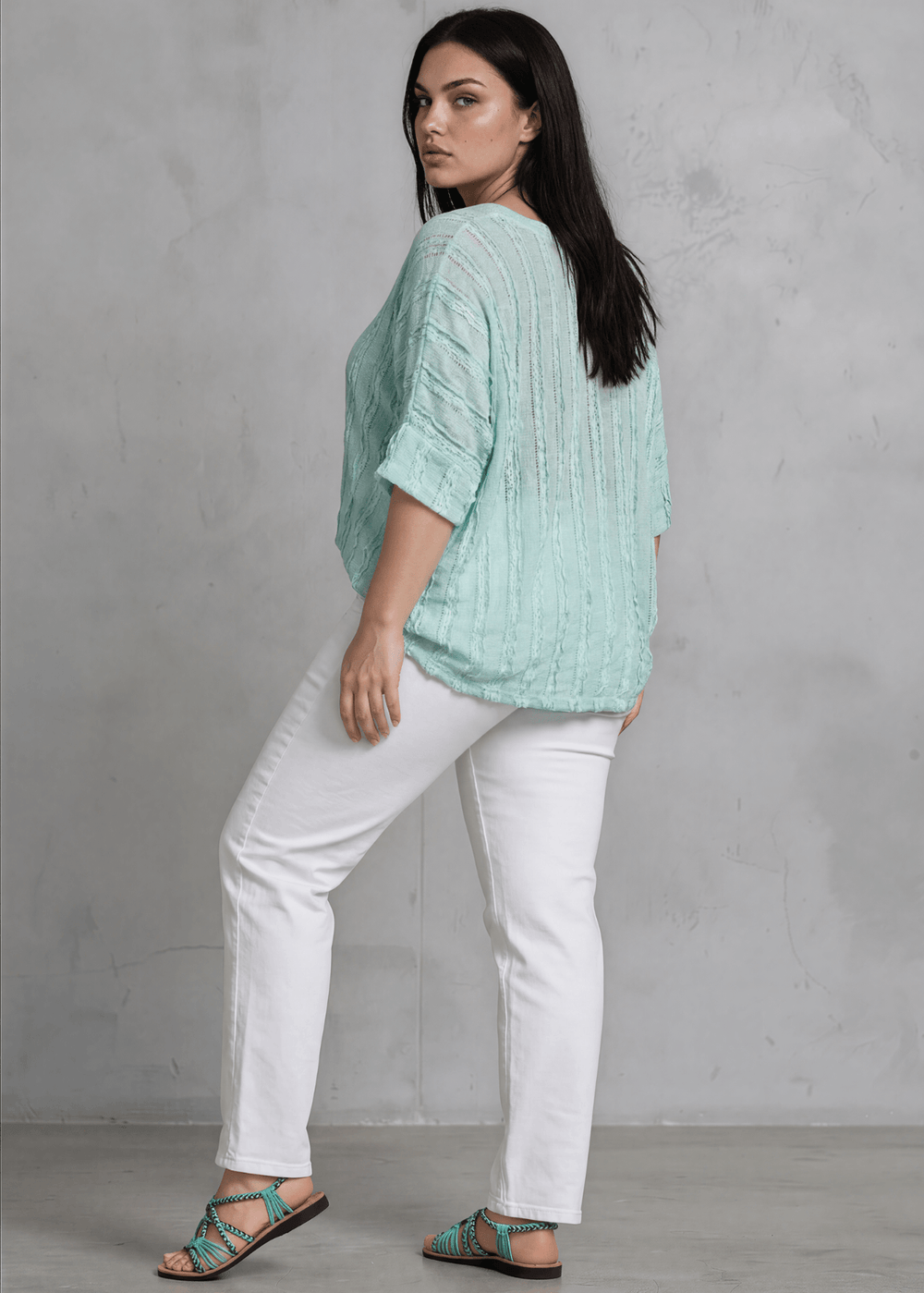 Shop the Plus Size Laurel Textured Top in Aqua Blue — a relaxed oversized v-neck with striped lace effect, contrast sleeve bands & side slit. Made in USA.