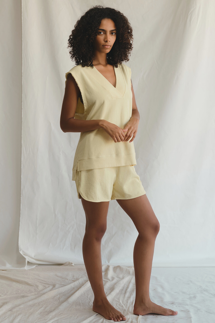 Shop the Villa Vest by People of Leisure — raw edge, ribbed V-neck in hemp &amp; organic cotton. Limoncello &amp; Sand. Sizes XS–XL.