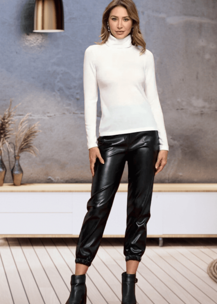 Made in USA, The Kate Classic Solid Knit Fitted Turtle Neck in Ivory offers a luxurious cashmere-like softness, crafted from a high-quality blend of 97% rayon and 3% spandex for comfortable stretch and fit. | Renee C Style