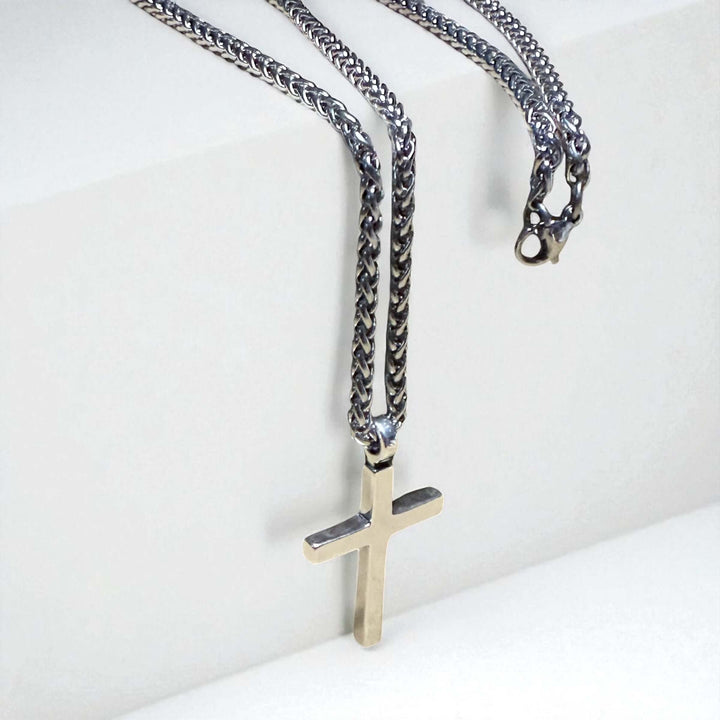 Handcrafted solid sterling silver cross necklace on a stainless steel chain. Custom lengths available. Made in USA with a lifetime warranty. 