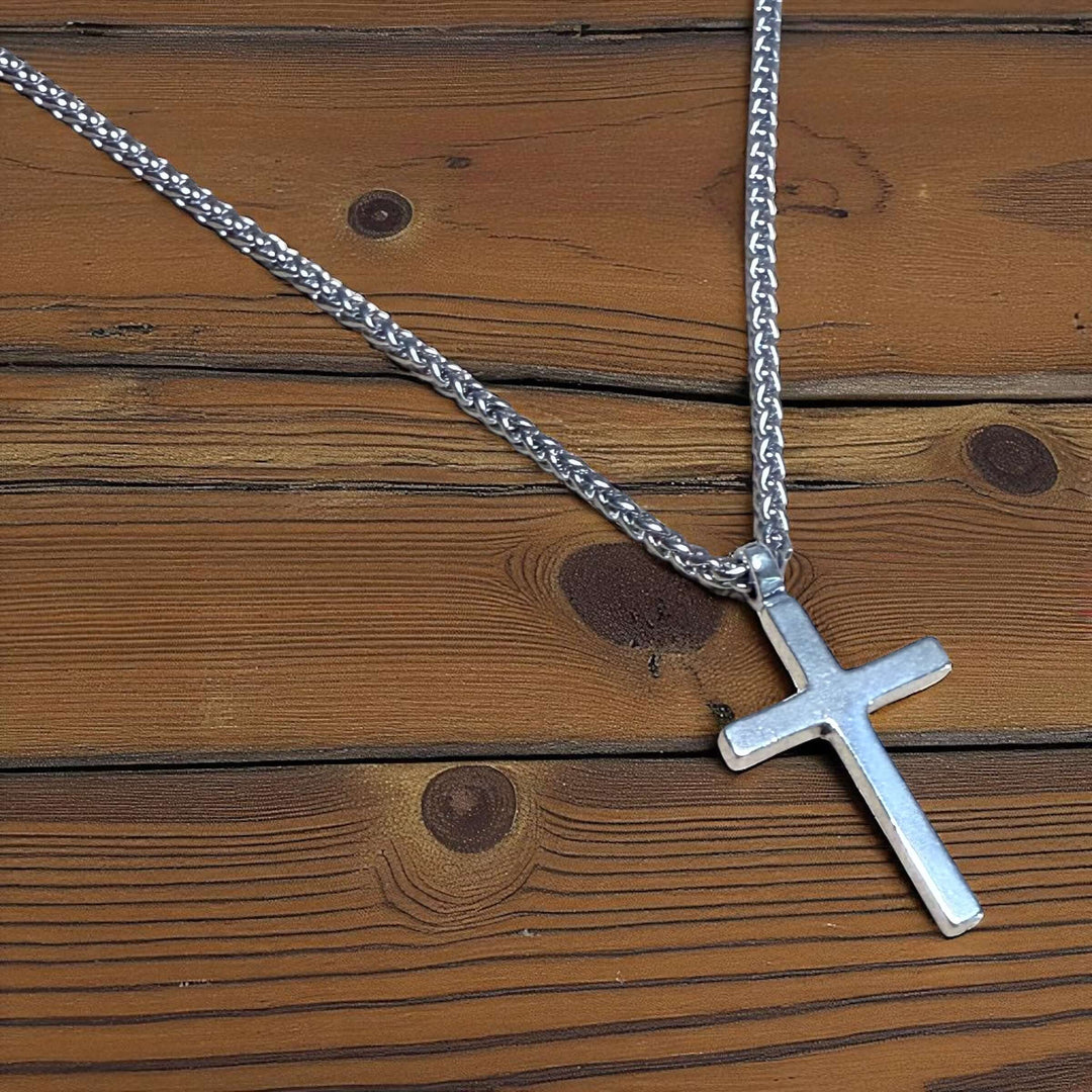 Handcrafted solid sterling silver cross necklace on a stainless steel chain. Custom lengths available. Made in USA with a lifetime warranty. 