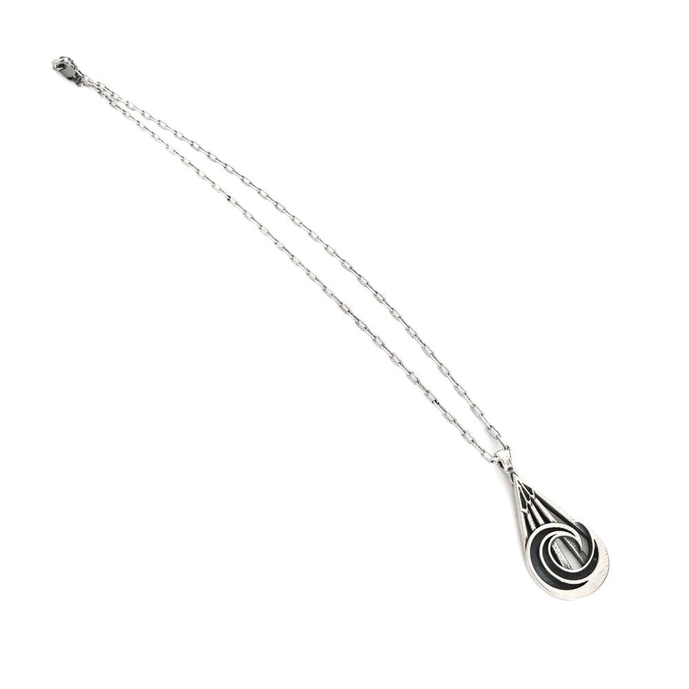 Handcrafted solid sterling silver mountain wave necklace on an 18-24 inch stainless steel chain. Made in USA with a lifetime warranty.