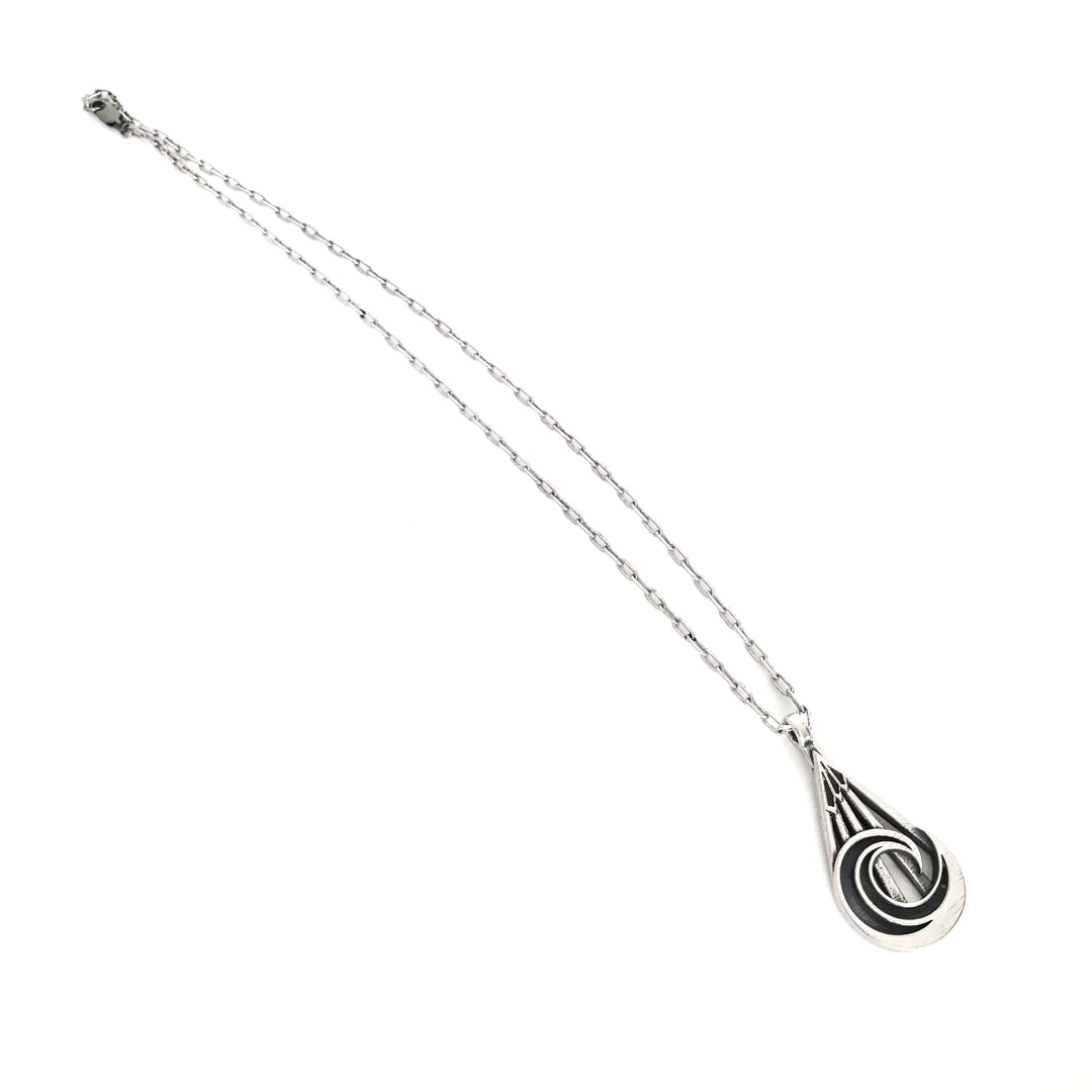 Handcrafted solid sterling silver mountain wave necklace on an 18-24 inch stainless steel chain. Made in USA with a lifetime warranty.