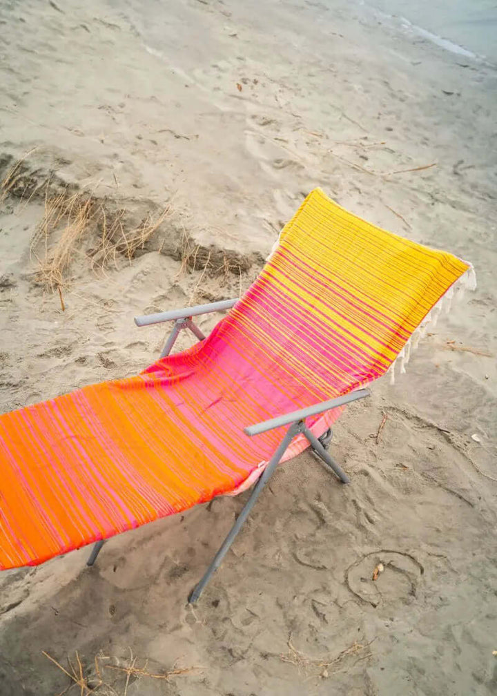 Shop the Beachables Striped 3-in-1 Turkish Cotton Beach Bag – converts from bag to towel to chair cover. Sand-resistant, quick-dry, machine washable. Made in USA.