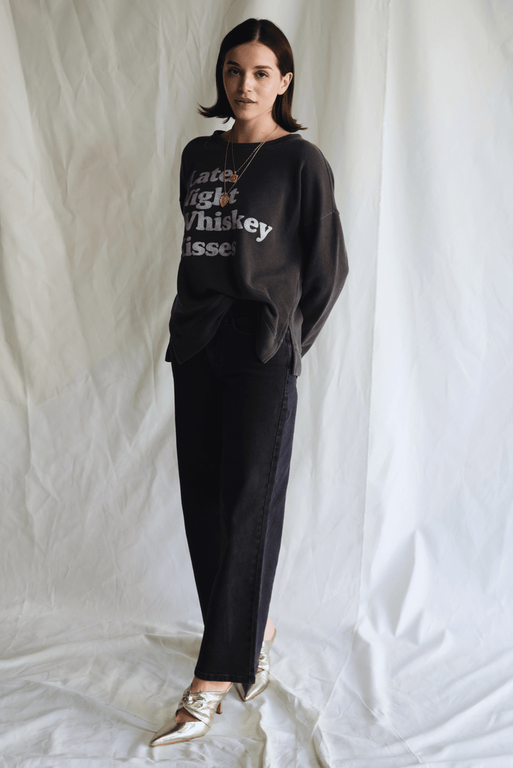 Whiskey Kisses Sweatshirt by People of Leisure — vintage-inspired graphic crewneck in Vintage Black. Ethically made in LA. Sizes XS–XL.
