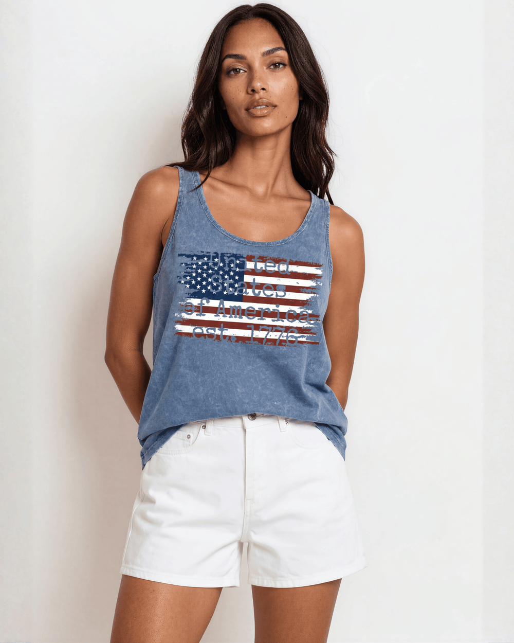 Women's distressed American flag graphic tank top, made in USA with USA-grown cotton. Light denim mineral wash, relaxed fit, soft & stretchy. Perfect for 4th of July.