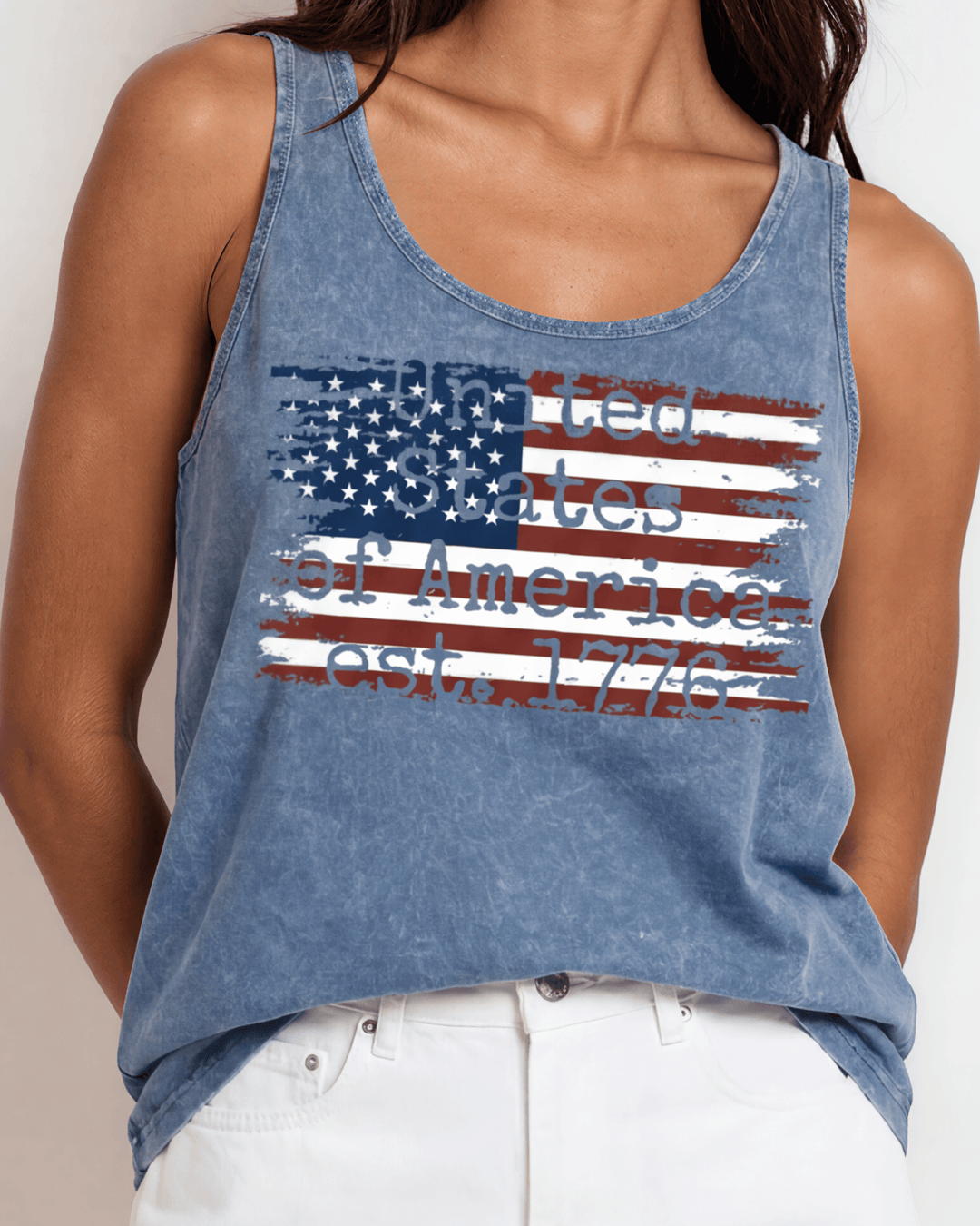 Women's distressed American flag graphic tank top, made in USA with USA-grown cotton. Light denim mineral wash, relaxed fit, soft & stretchy. Perfect for 4th of July.