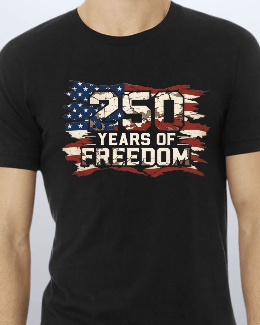 250 Years of Freedom Distressed Flag Tee — Made in USA. Bold cracked flag graphic on black, soft 100% cotton, relaxed fit. Perfect for 4th of July. Sizes S-XL.